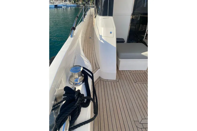  Yacht Photos Pics 2019 Sunseeker Manhattan 66 yacht deck with sleek design and mooring rope.