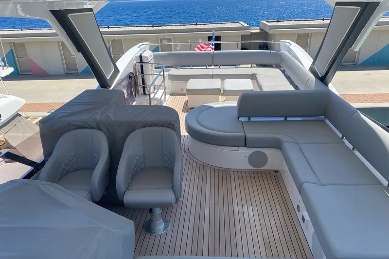  Yacht Photos Pics Luxurious 2019 Sunseeker Manhattan 66 yacht deck with elegant seating and ocean view.