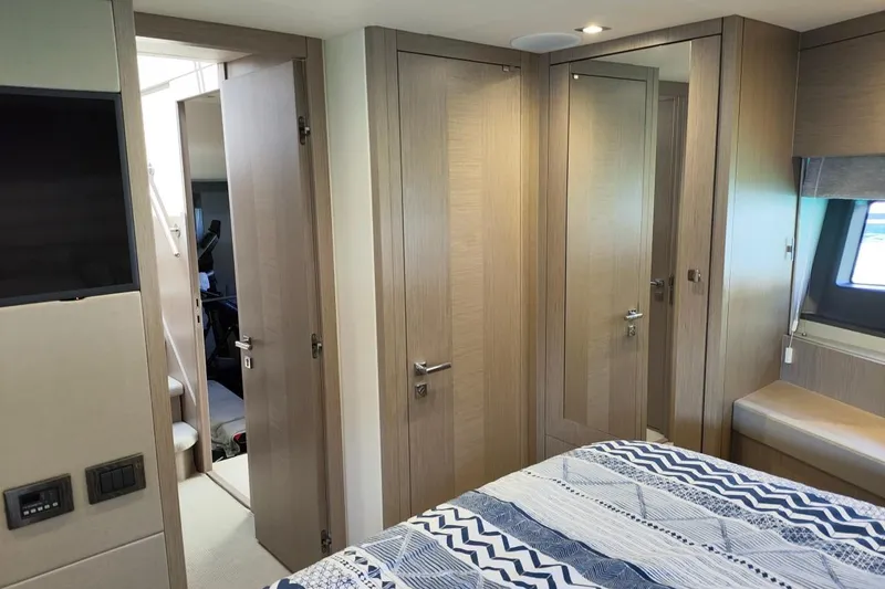  Yacht Photos Pics Interior of 2019 Sunseeker Manhattan 66 yacht bedroom with modern wood finish.