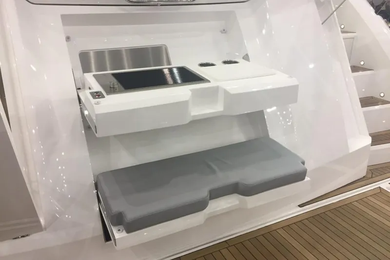  Yacht Photos Pics 2019 Sunseeker Manhattan 66 yacht with sleek white interior and modern seating area.