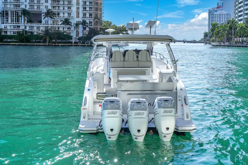  Yacht Photos Pics Azimut Verve 40 yacht, 2020 model, cruising in turquoise waters near urban skyline.