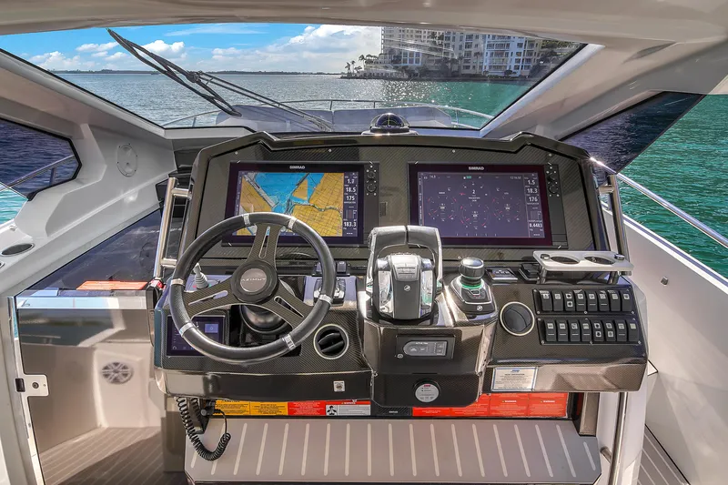  Yacht Photos Pics Cockpit of 2020 Azimut Verve 40 yacht with navigation screens and steering wheel.