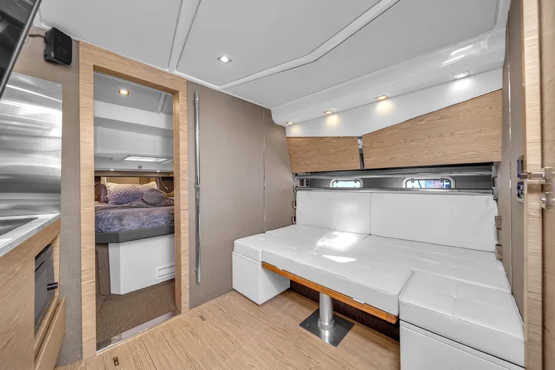  Yacht Photos Pics Luxurious interior of 2020 Azimut Verve 40 yacht with modern seating and cozy bedroom.