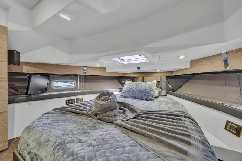  Yacht Photos Pics Luxurious cabin interior of 2020 Azimut Verve 40 yacht with plush bedding.