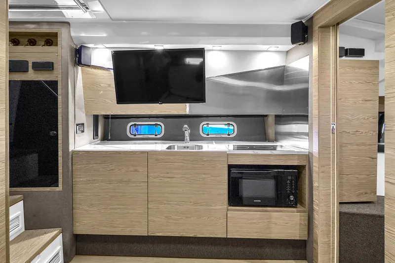  Yacht Photos Pics Modern kitchen interior of 2020 Azimut Verve 40 yacht with sleek cabinetry and appliances.