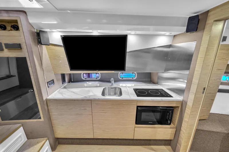  Yacht Photos Pics Modern kitchen interior of 2020 Azimut Verve 40 yacht with sleek appliances.