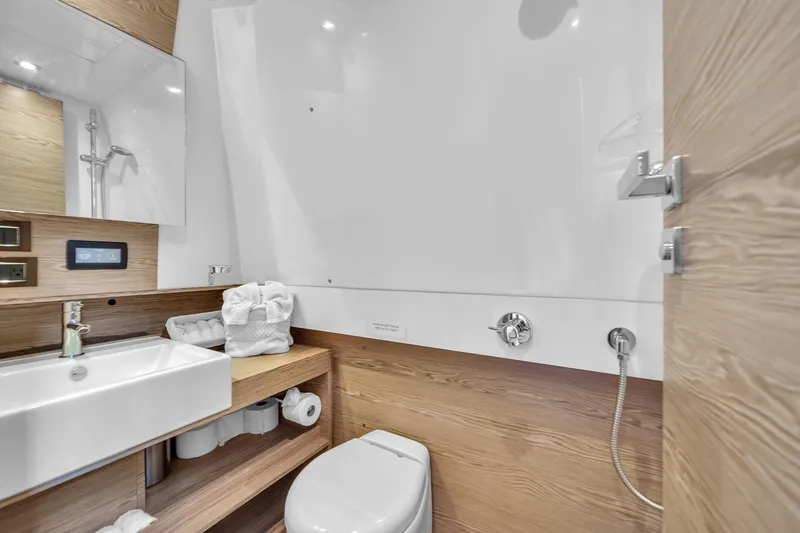  Yacht Photos Pics Modern bathroom in 2020 Azimut Verve 40 yacht with sleek fixtures and wooden accents.