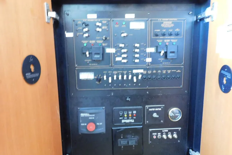 How Lucky Yacht Photos Pics Electrical control panel inside 2003 Cruisers Yachts 3750 Motoryacht, featuring switches and gauges.