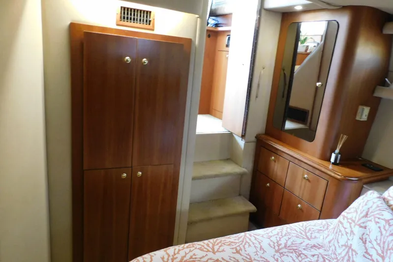 How Lucky Yacht Photos Pics 2003 Cruisers Yachts 3750 Motoryacht interior with wooden cabinetry and stairs.