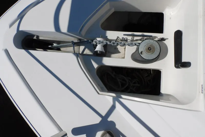 How Lucky Yacht Photos Pics 2003 Cruisers Yachts 3750 Motoryacht anchor and chain mechanism on deck.