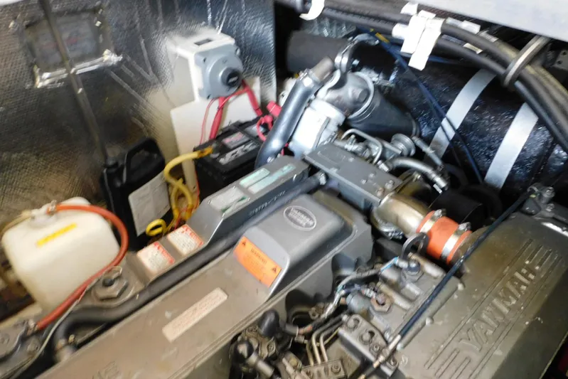 How Lucky Yacht Photos Pics Engine compartment of 2003 Cruisers Yachts 3750 Motoryacht with visible components and wiring.