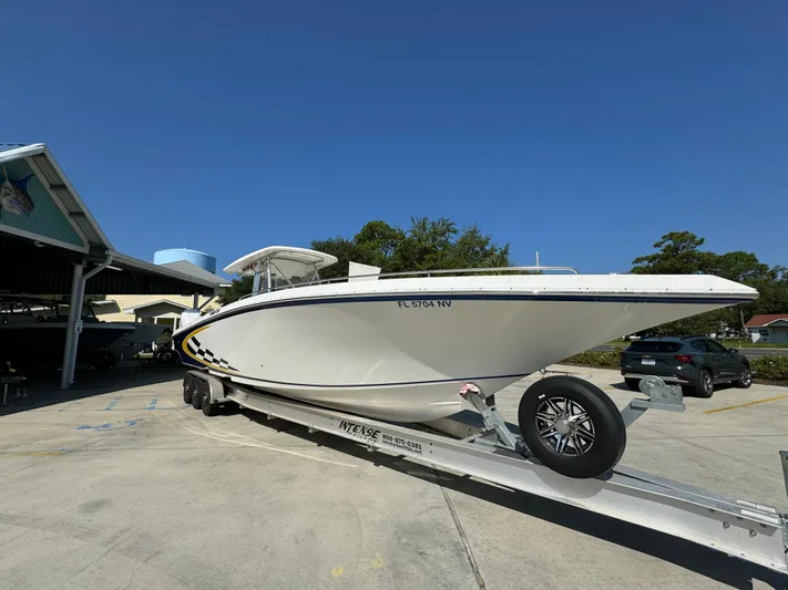  Yacht Photos Pics 2009 Fountain 38 CC Tournament Edition boat on trailer, parked outdoors.