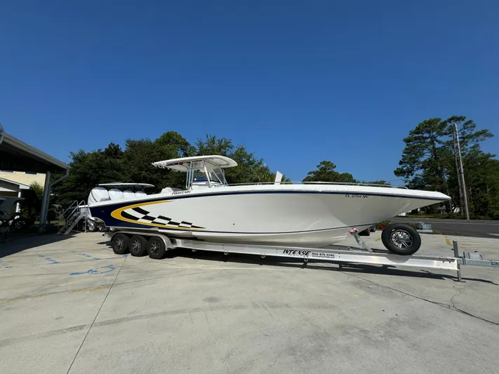  Yacht Photos Pics 2009 Fountain 38 CC Tournament Edition boat on trailer, parked outdoors.