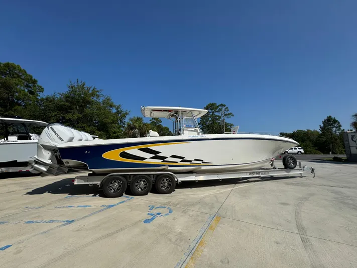  Yacht Photos Pics 2009 Fountain 38 CC Tournament Edition boat on trailer, side view.