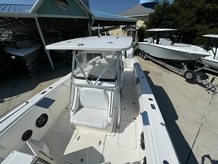  Yacht Photos Pics 2009 Fountain 38 CC Tournament Edition boat in marina, white exterior, center console.