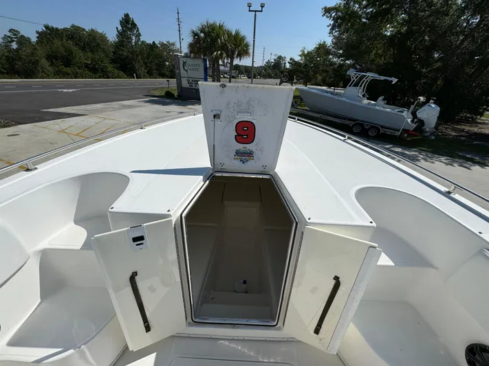  Yacht Photos Pics 2009 Fountain 38 CC Tournament Edition boat with open storage compartment.