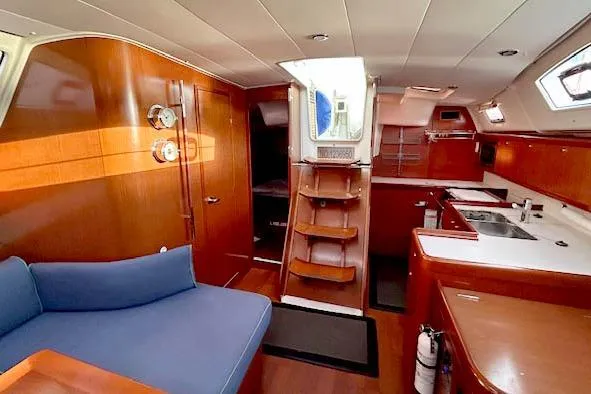 Unfettered Yacht Photos Pics Interior of 2011 Beneteau Oceanis 40 yacht with wooden finish and modern amenities.