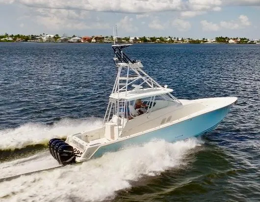 Saltwater Striker Yacht Photos Pics 2016 SeaVee 430 Fish Around boat cruising on open water, showcasing sleek design and powerful engines.