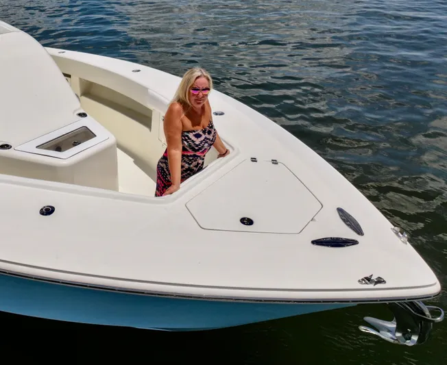 Saltwater Striker Yacht Photos Pics Woman on 2016 SeaVee 430 Fish Around boat in water.