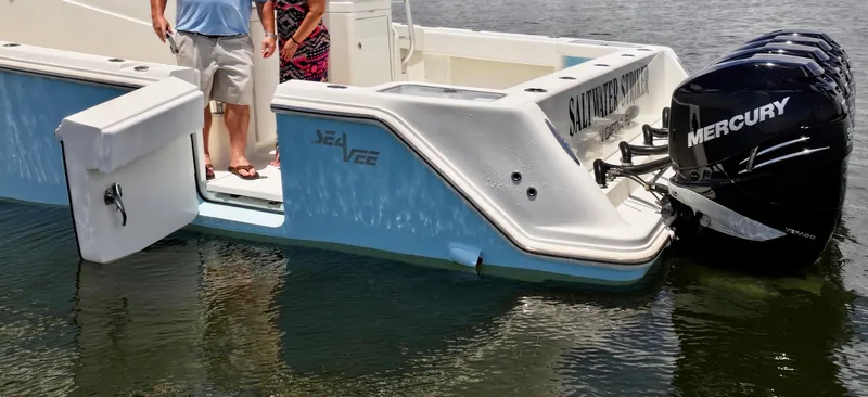 Saltwater Striker Yacht Photos Pics 2016 SeaVee 430 Fish Around boat with Mercury engines on calm water.