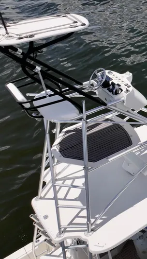 Saltwater Striker Yacht Photos Pics 2016 SeaVee 430 Fish Around boat with elevated helm, docked on calm water.