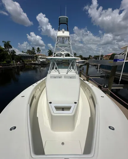 Saltwater Striker Yacht Photos Pics 2016 SeaVee 430 Fish Around boat docked under a clear blue sky.