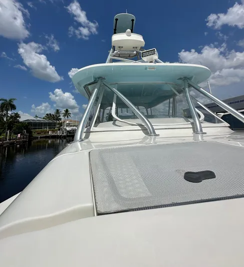 Saltwater Striker Yacht Photos Pics 2016 SeaVee 430 Fish Around boat under a clear blue sky with clouds.