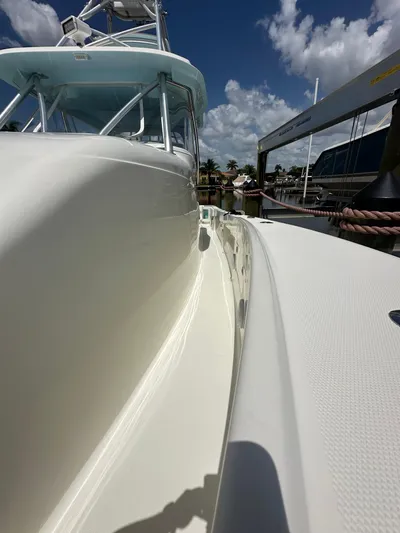 Saltwater Striker Yacht Photos Pics 2016 SeaVee 430 Fish Around boat docked under a clear blue sky.