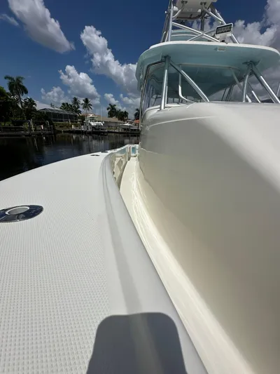 Saltwater Striker Yacht Photos Pics 2016 SeaVee 430 Fish Around boat docked under a clear blue sky.