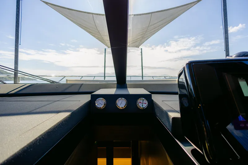 Catissa Yacht Photos Pics 2024 Ferretti Yachts 670 helm with modern instruments and sleek design.