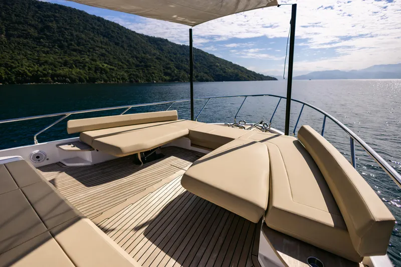 Catissa Yacht Photos Pics Luxurious 2024 Ferretti Yachts 670 deck with elegant seating, scenic ocean view.