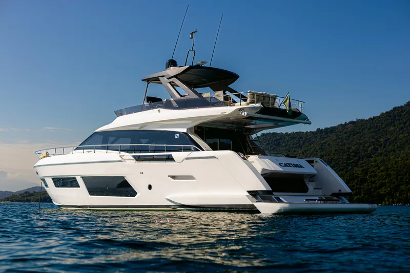 Catissa Yacht Photos Pics 2024 Ferretti Yachts 670 luxury yacht on calm water, scenic background.