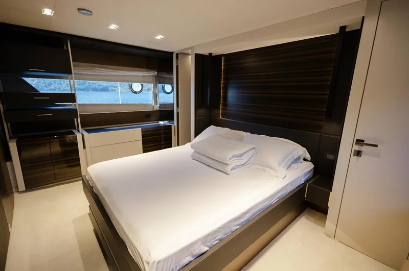 Catissa Yacht Photos Pics Luxurious bedroom interior of 2024 Ferretti Yachts 670 with modern design and scenic window view.