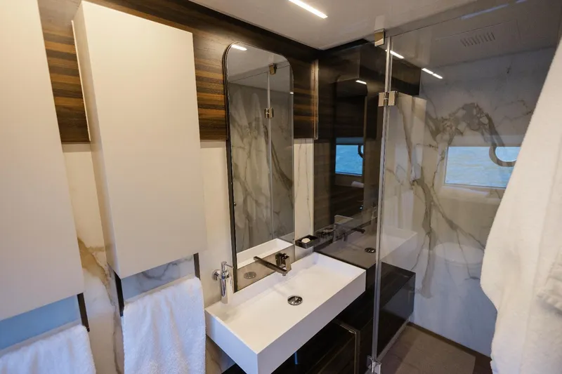 Catissa Yacht Photos Pics Luxurious bathroom in 2024 Ferretti Yachts 670, featuring modern design and elegant finishes.