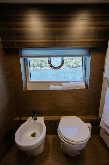 Catissa Yacht Photos Pics Luxurious bathroom in 2024 Ferretti Yachts 670 with sea view window.