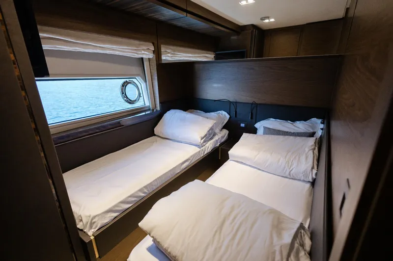 Catissa Yacht Photos Pics Luxurious cabin interior of 2024 Ferretti Yachts 670 with twin beds and ocean view.