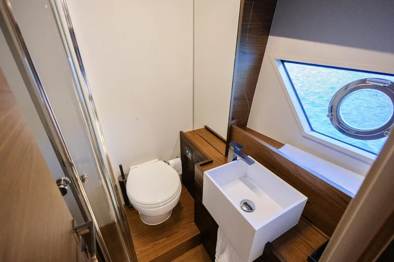 Catissa Yacht Photos Pics Luxurious bathroom in 2024 Ferretti Yachts 670, featuring modern fixtures and ocean view.