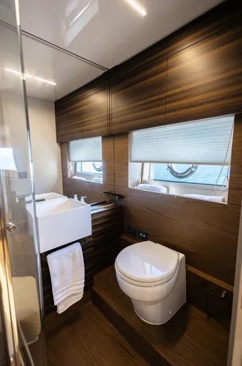 Catissa Yacht Photos Pics Luxurious bathroom in 2024 Ferretti Yachts 670, featuring modern fixtures and elegant wood finishes.