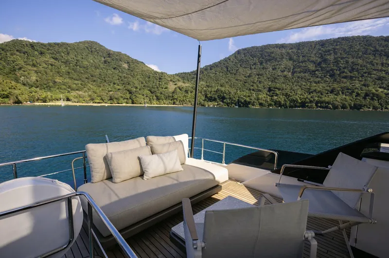 Catissa Yacht Photos Pics Luxurious 2024 Ferretti Yachts 670 deck with scenic lake and mountain views.