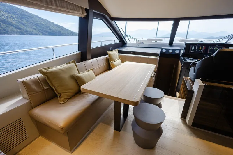 Catissa Yacht Photos Pics Luxurious interior of 2024 Ferretti Yachts 670 with elegant seating and scenic ocean view.