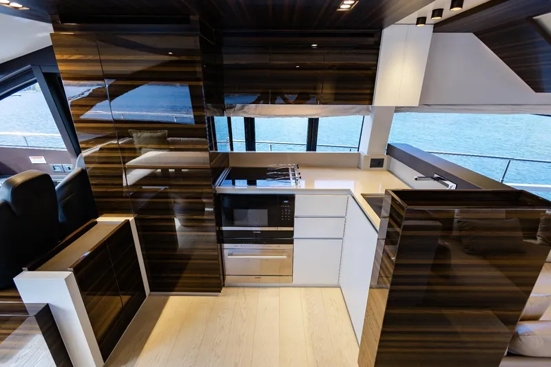 Catissa Yacht Photos Pics Luxurious kitchen interior of 2024 Ferretti Yachts 670 with modern appliances and sleek design.