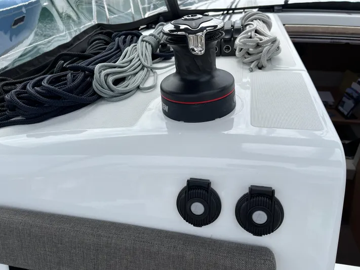  Yacht Photos Pics 2024 Jeanneau Sun Odyssey 410 deck with winch and neatly coiled ropes.