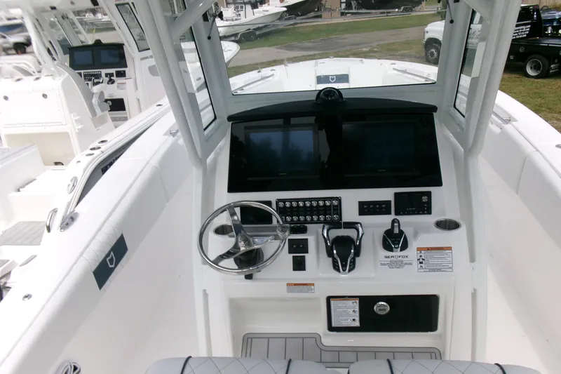 Black Label Marine Yacht Photos Pics 2026 Sea Fox 288 Commander boat dashboard with steering wheel and control panels.