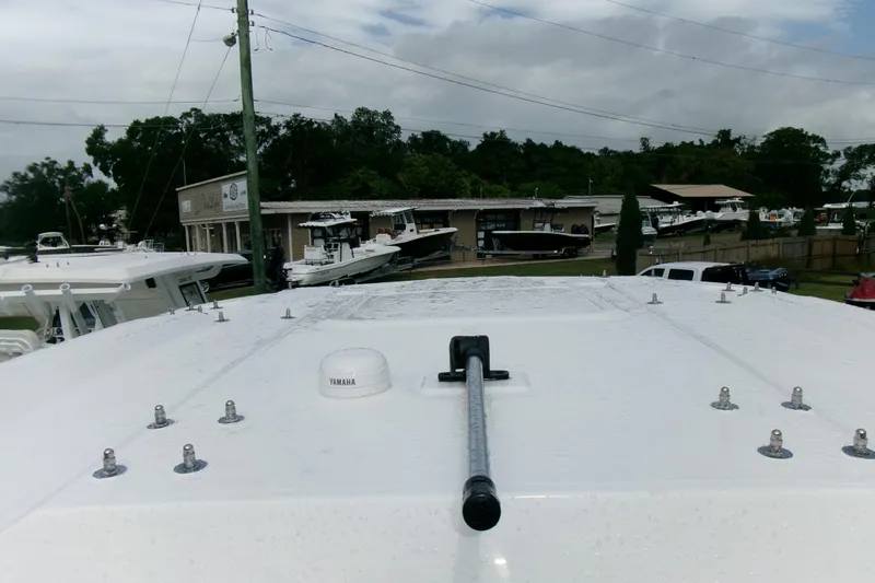 Black Label Marine Yacht Photos Pics 2026 Sea Fox 288 Commander boat roof with Yamaha equipment, dealership in background.