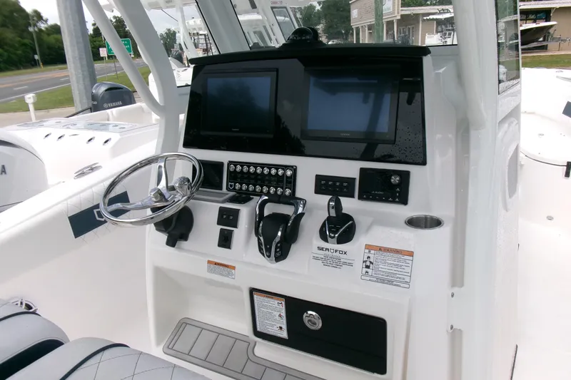 Black Label Marine Yacht Photos Pics 2026 Sea Fox 288 Commander boat dashboard with steering wheel and electronic controls.