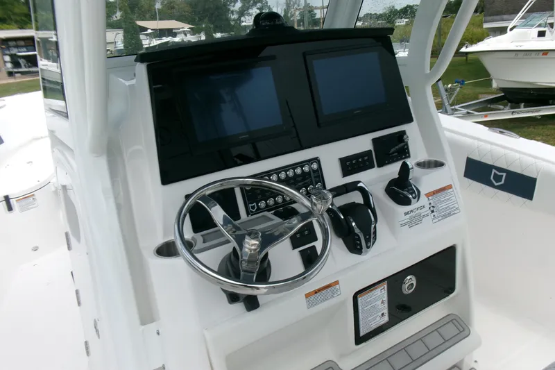 Black Label Marine Yacht Photos Pics 2026 Sea Fox 288 Commander boat dashboard with steering wheel and dual screens.