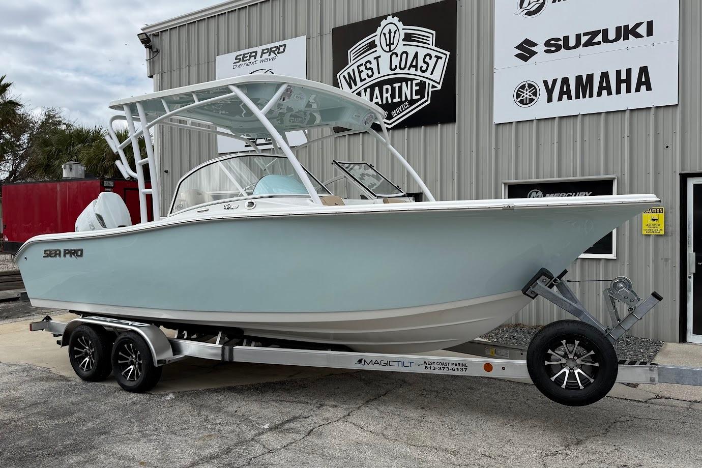 2026 Sea Pro 240 Dual Console boat on trailer at West Coast Marine dealership.