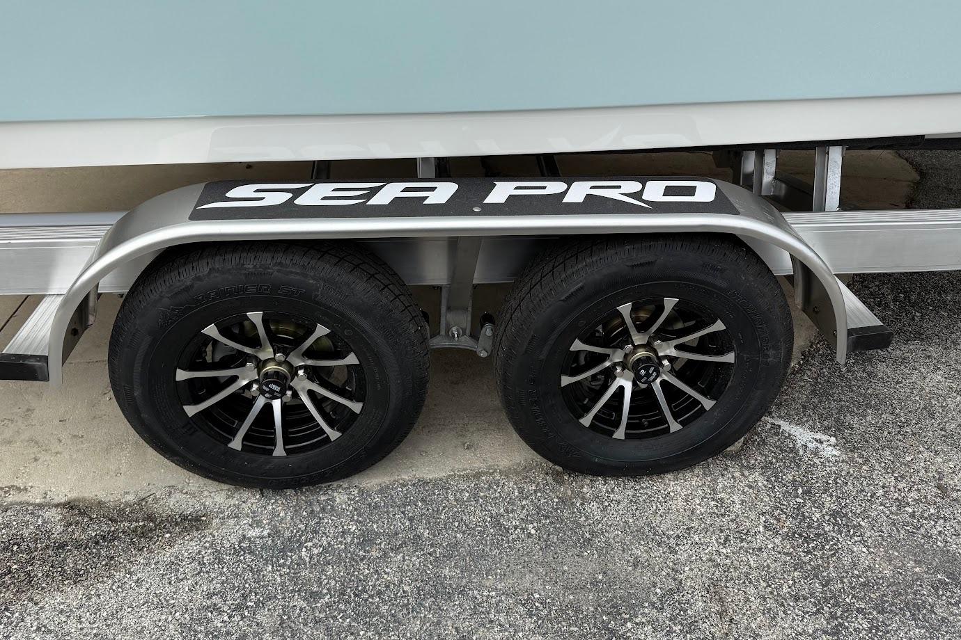Trailer of 2026 Sea Pro 240 Dual Console with stylish black wheels.