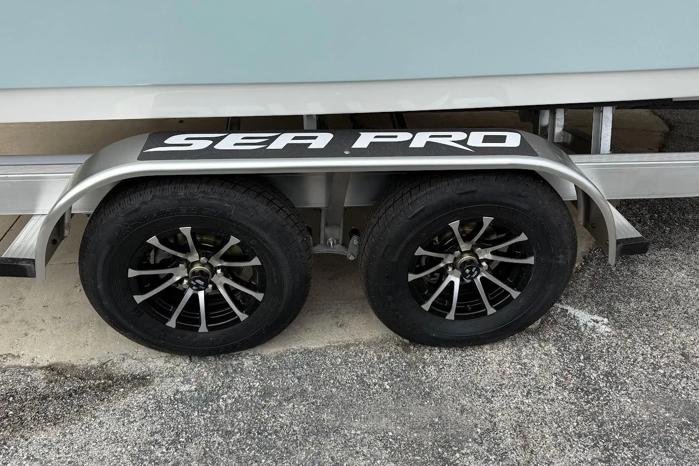 Trailer of 2026 Sea Pro 240 Dual Console with stylish black wheels.