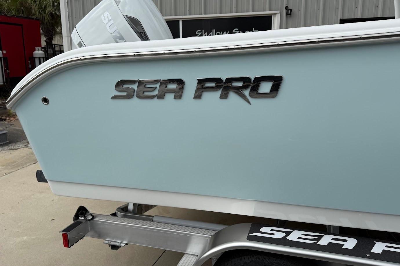 2026 Sea Pro 240 Dual Console boat on trailer, featuring sleek design and branding.